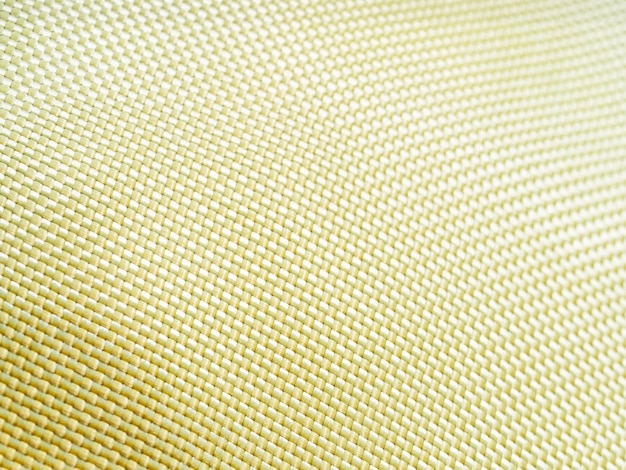 Material a prueba de balas aramida Fondo de aramida kevlar Textura y patrón de kevlar dorado