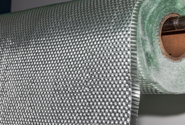 Material de rollo compuesto de tela de fibra de vidrio