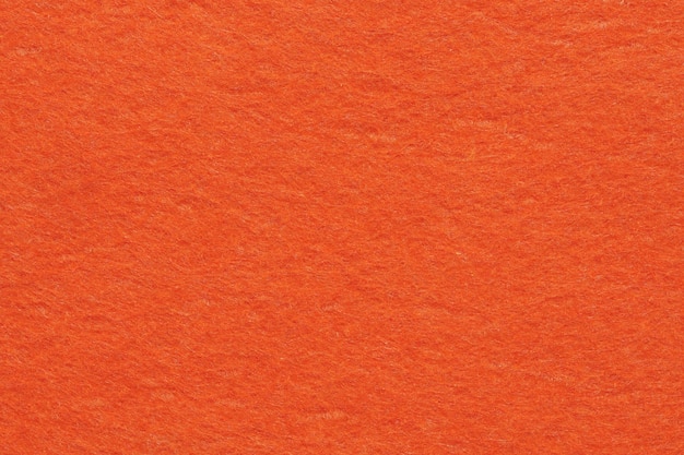 Material têxtil de feltro macio, cores laranja brilhantes, textura colorida, aba de fundo de tecido