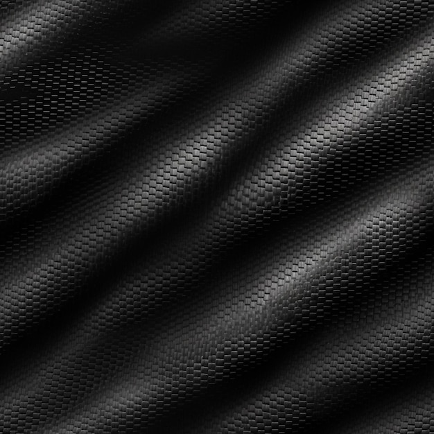 Material texturizado negro que está fabricado por la empresa fibra de carbono.