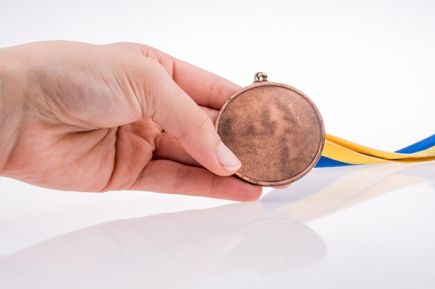 Foto medalla en la mano