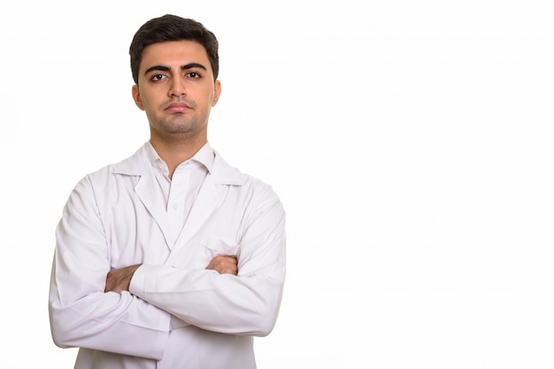 Foto médico joven guapo con los brazos cruzados