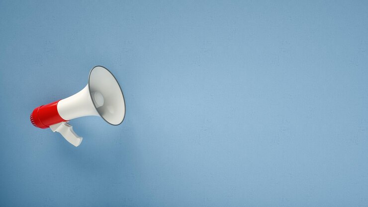 Foto megafone na frente de uma renderização 3d de fundo azul