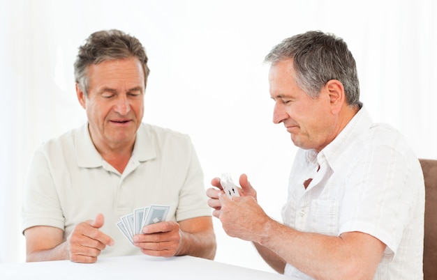 Men playing cards on the table