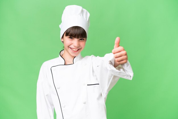 Menina chef caucasiana sobre fundo isolado, dando um polegar para cima gesto