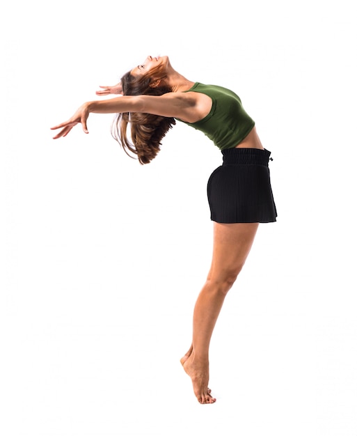 Foto menina jovem, dançar, e, pular, em, estúdio, ligado, isolado, fundo