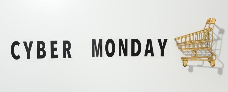 Foto mensaje de cyber monday con carrito de compras sobre fondo claro