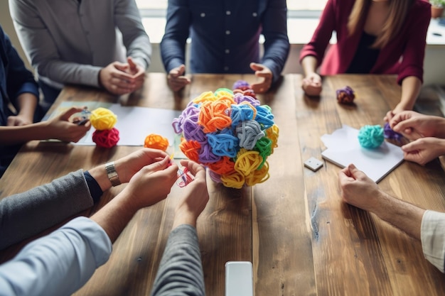 Foto menschen sitzen um einen tisch mit einem tisch voller bunter blumen