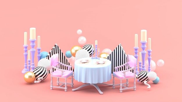 Mesa y candelabro entre bolas de colores en el espacio rosa