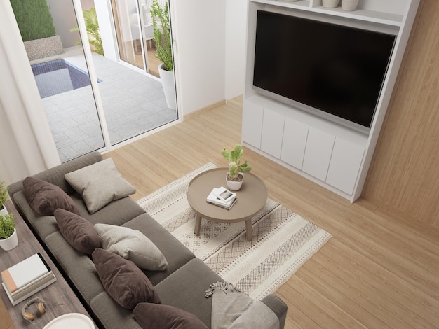 Mesa de centro en el piso de madera de la luminosa sala de estar y sofá contra la TV en la casa moderna