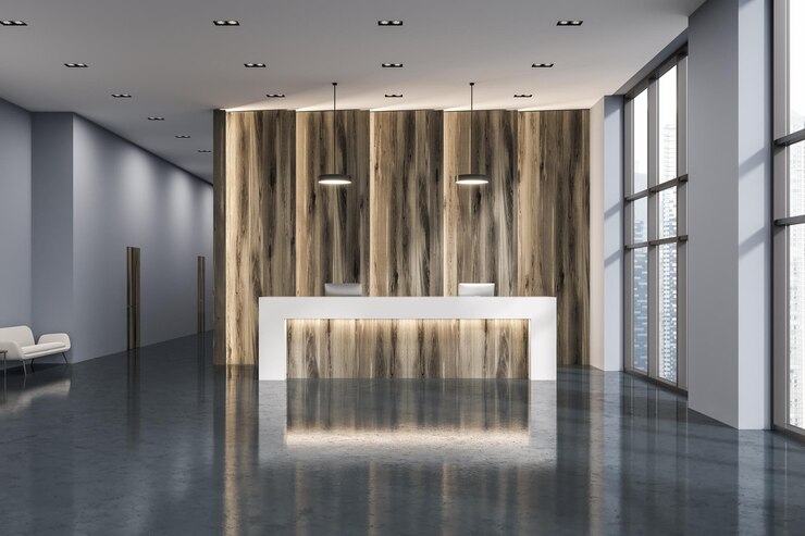 Foto mesa de recepção branca e de madeira com dois computadores em um escritório moderno de parede cinza e madeira com piso de concreto. simulação de renderização 3d