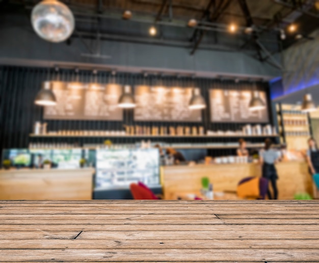 Foto mesa en la decoración de barra de mostrador de escena borrosa en cafetería