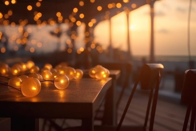 Una mesa con luces y un atardecer de fondo.