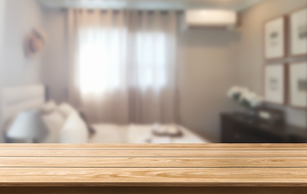 Foto mesa de madera en la decoración de la habitación del hogar moderno.