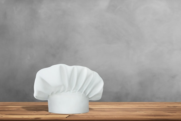 Mesa de madera con espacio vacío y sombrero de cocinero