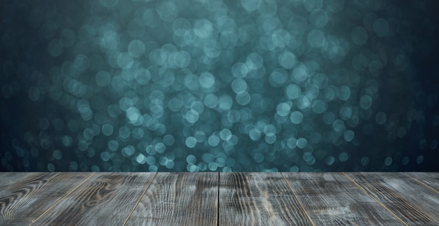 Mesa de madera oscura y fondo verde borroso bokeh.