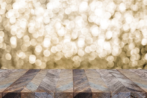 Mesa de madera vacía con desenfoque bokeh oro abstracto fondo