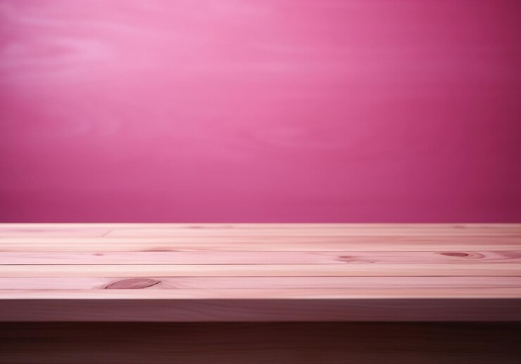 Una mesa de madera vacía minimalista con un fondo rosa de estudio