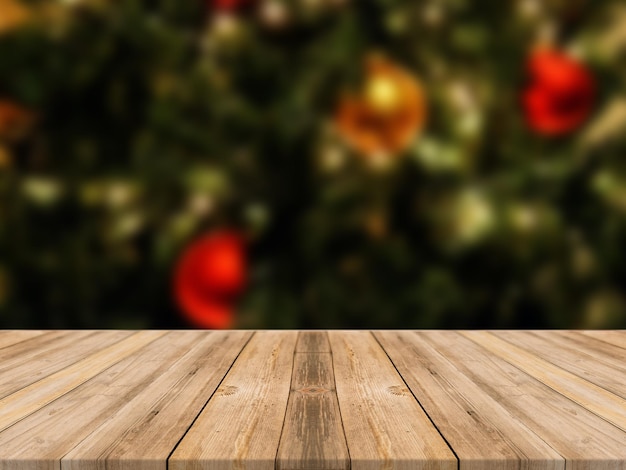 Mesa de madera vacía y sala de desenfoque con un fondo de árbol de Navidad, adecuada para productos de montaje