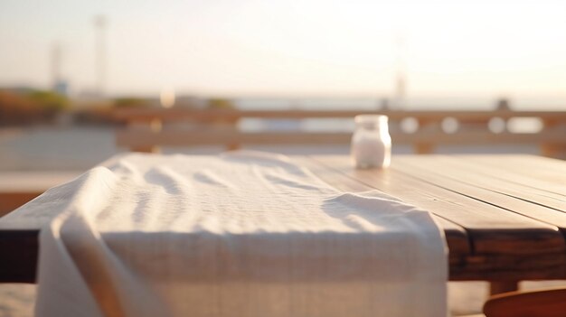 Mesa vacía con mantel blanco para exhibición de productos en la playa de mar fondo borroso Ai generativo