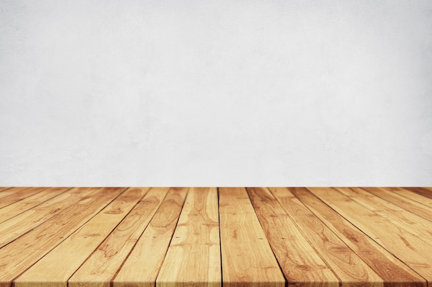 Mesa vacía de tabla de madera marrón para la exhibición de productos con fondo gris suave
