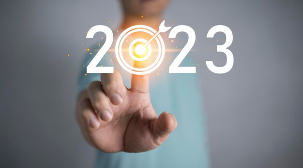 Metas e objetivos de negócios Ideias para o ano novo de 2023 Dedos no alvo para os negócios de ano novo de 2023