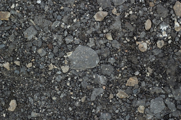 Migas de asfalto gris de fondo de diferentes tamaños