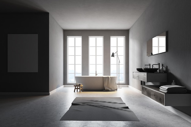 Minimalistischer Badezimmerinnenraum mit hohen Fenstern, grauen Wänden, Betonboden und weißer Badewanne. Ein Poster an der Wand. 3D-Rendering-Attrappe