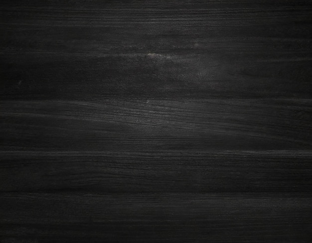 Misteriosa textura de madera negra capturada con poca luz que provoca una vibración minimalista y contemporánea