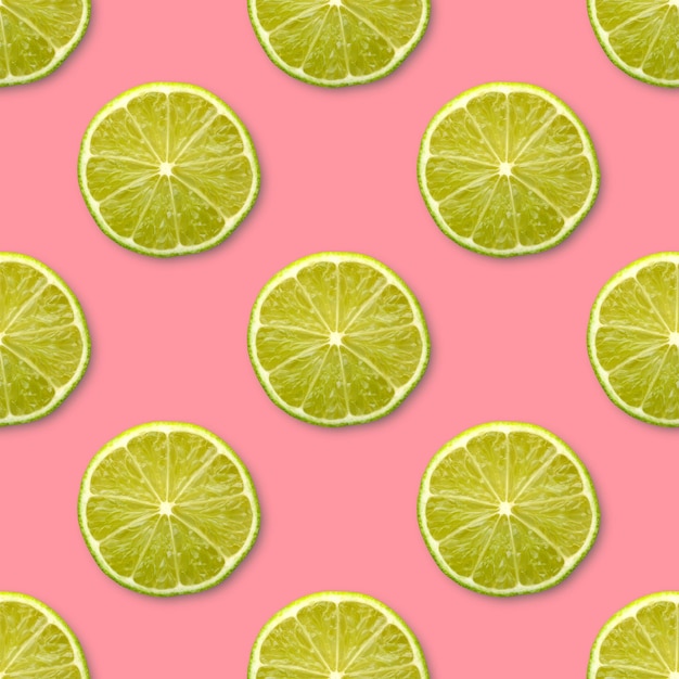 Mitades de limón sobre un fondo rosa de patrones sin fisuras vista superior fondo de cítricos de frutas