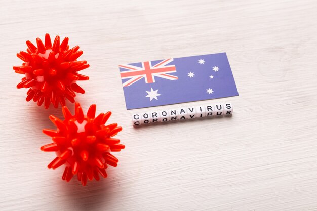 Modelo abstracto de la cepa del virus del coronavirus del síndrome respiratorio de Oriente Medio 2019-nCoV o coronavirus COVID-19 con texto y bandera de Nueva Zelanda en blanco