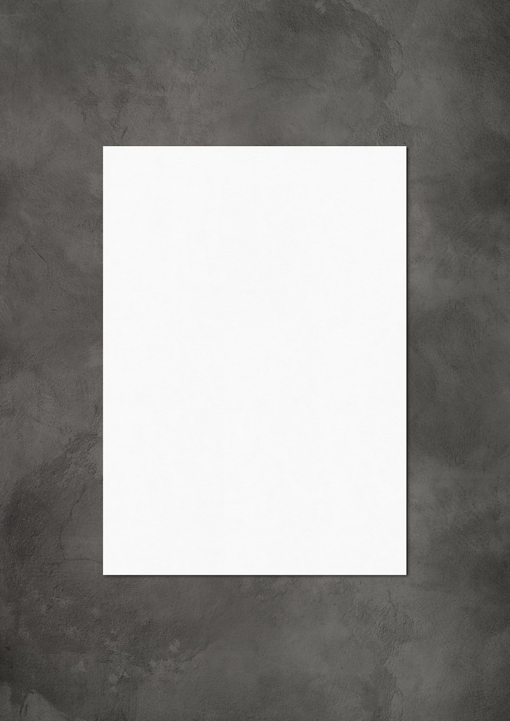 Foto modelo de maquete de folha de papel em branco isolado em concreto escuro