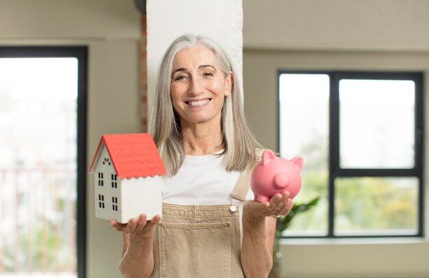 Foto modelo segurando um conceito de casa em casa