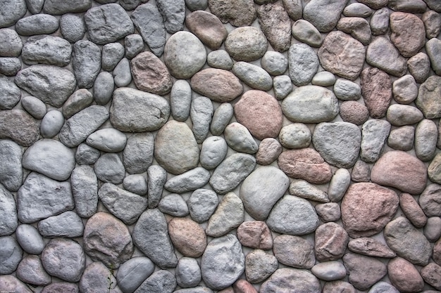 Moderne Art des Baus der schönen ovalen Steinwand mit Zement
