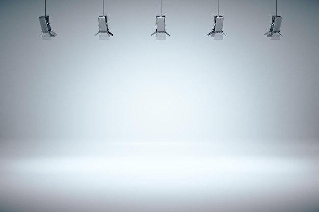 Moderno salón gris vacío con pared en blanco y foco