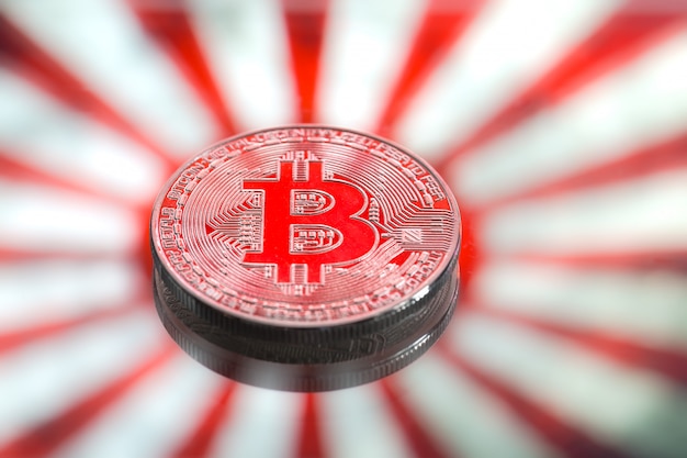 Moedas bitcoin, no japão e na bandeira japonesa, conceito de dinheiro virtual, close-up. imagem conceitual.