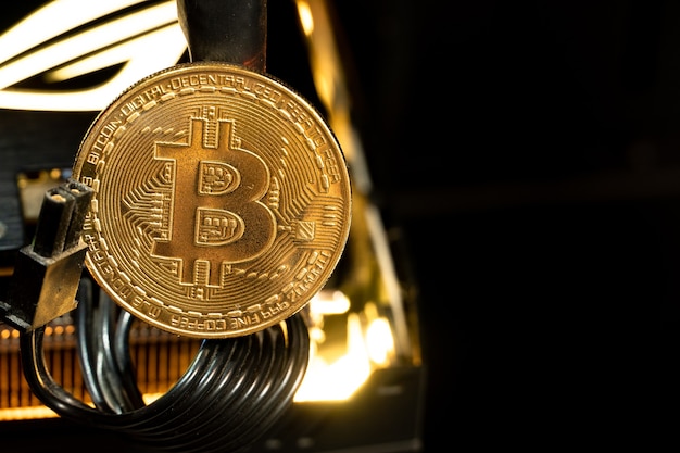 Moedas de ouro Bitcoin em um gpu. O futuro do dinheiro.