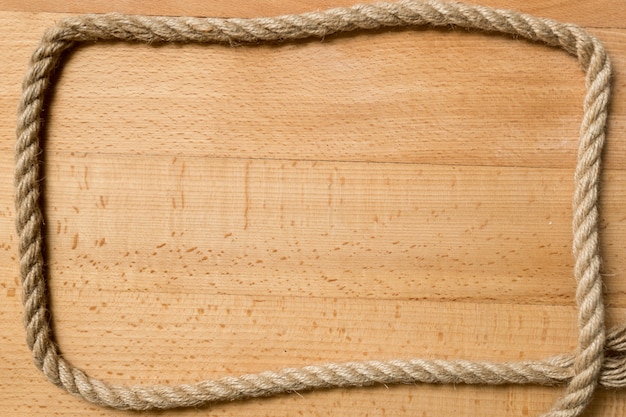 Foto moldura para texto ou para vista de corda marinha em placas de madeira