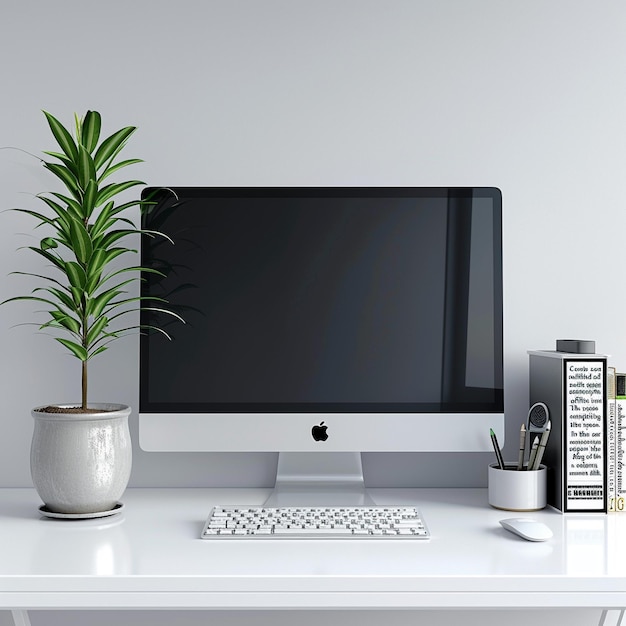 Foto un monitor de computadora con una planta en él al lado de una planta en maceta