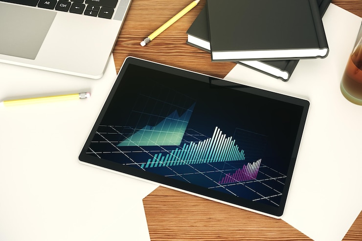 Foto monitor de tableta digital moderno con concepto de análisis e investigación de gráficos financieros creativos abstractos vista superior representación 3d