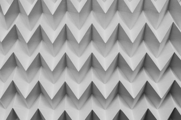 Monocromo papel natural abstracto plegado rompecabezas de origami patrón futurista
