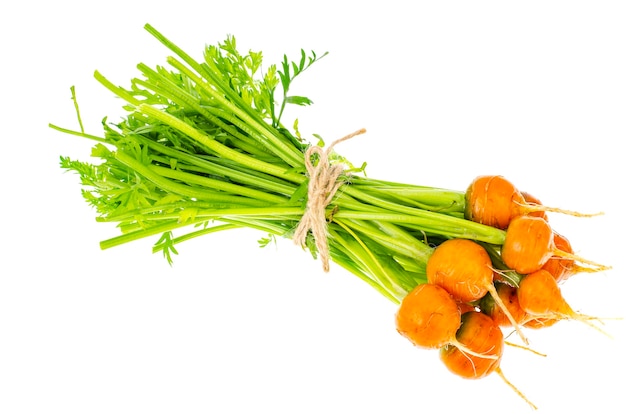 Montón de zanahorias redondas frescas, verduras orgánicas, comida vegetariana.