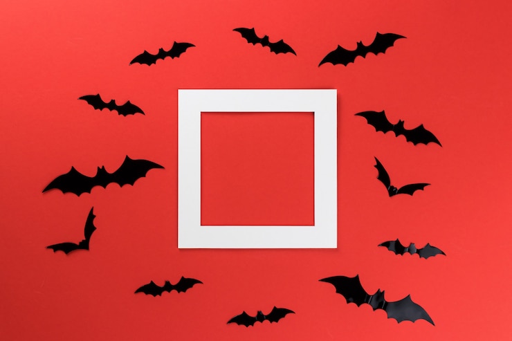 Foto morcegos de halloween em um fundo vermelho