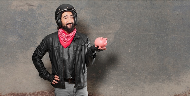 Motorradfahrer mit einem piggybank