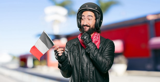 Foto motorradfahrer mit einer frankreich-flagge