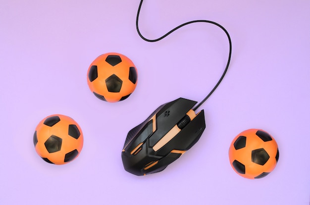 Mouse óptico para jogos e pequenas bolas de futebol laranja