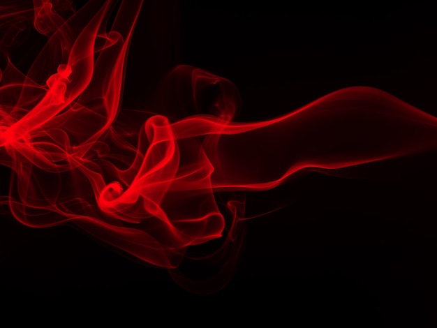 Movimiento de humo rojo abstracto sobre fondo negro, diseño de fuego