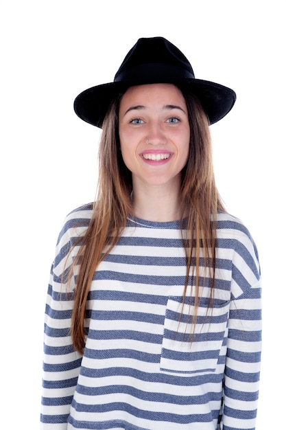 Muchacha bonita del adolescente con el sombrero negro que presenta en el estudio.