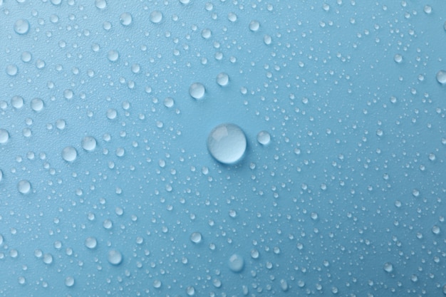 Muchas gotas de agua en azul. Textura.