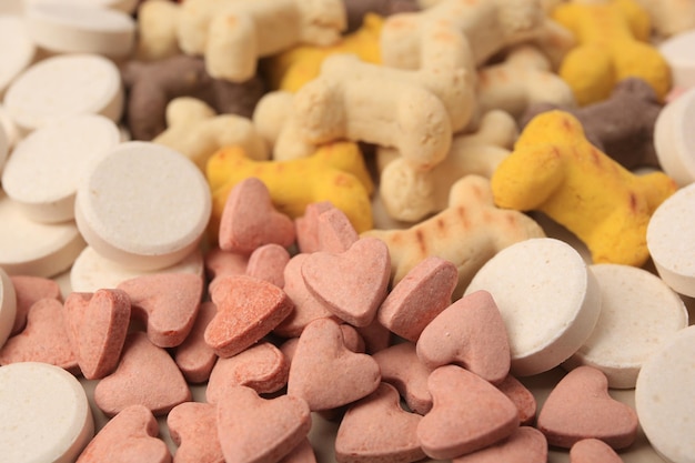 Muchas vitaminas diferentes para mascotas como primer plano de fondo